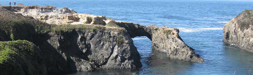 Sea arch and people on trail at Jughandle beach - Photo by Art Quadraccia