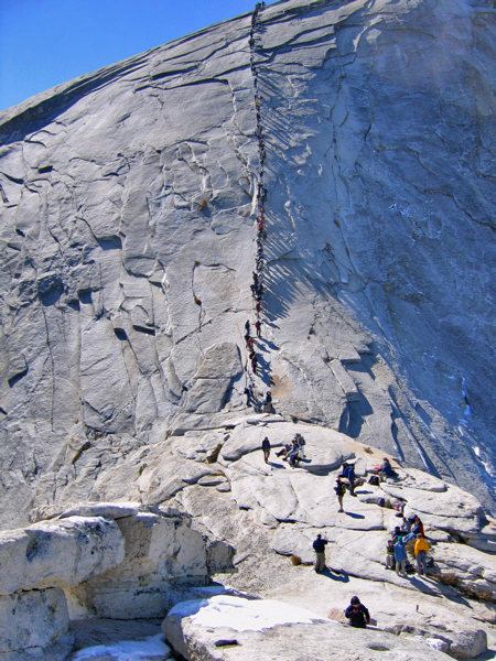 Climbers ascending the Half Dome cables in Yosemite National Park. Photo by Christine Sculati.